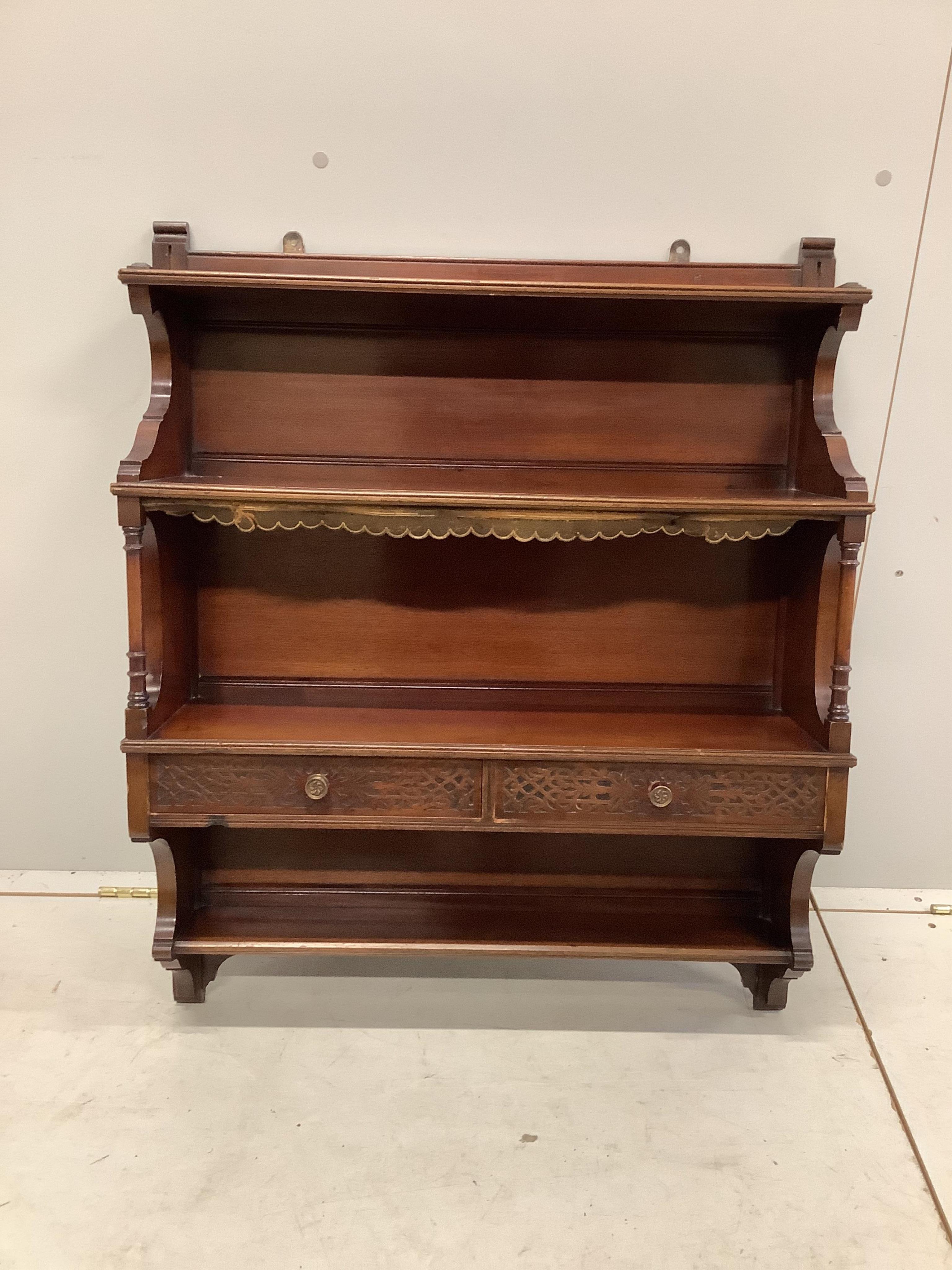 An 18th century walnut toilet mirror, height 43cm, an Edwardian inlaid fret cut wall mirror and an Edwards and Roberts mahogany wall bracket. Condition - fair to good.